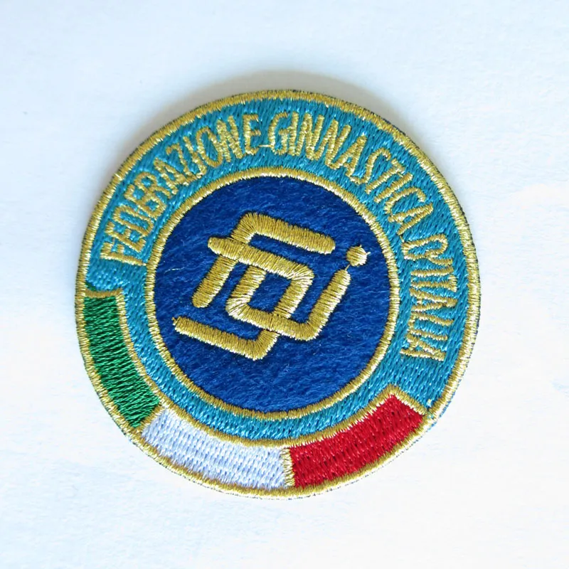 A custom embroidered patch for a sports team, featuring a merrowed border and vibrant thread colors