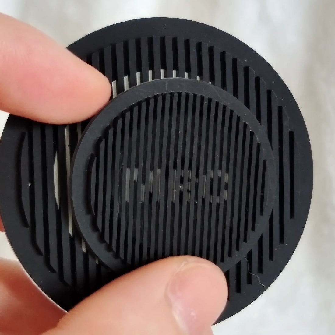 Smartphone scanning NFC enabled silicone badge on jacket.