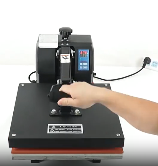 A factory worker ensuring a perfect heat press application of a custom TPU badge onto a black sports garment.